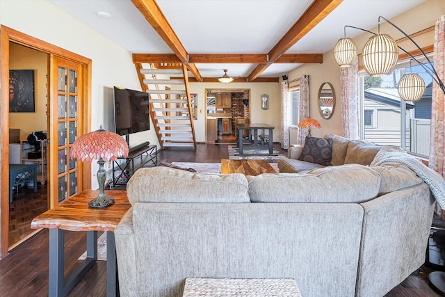 5003 N Normandie St, Spokane, WA 99205 - living area featuring dark wood finished floors, beam ceiling, and stairs