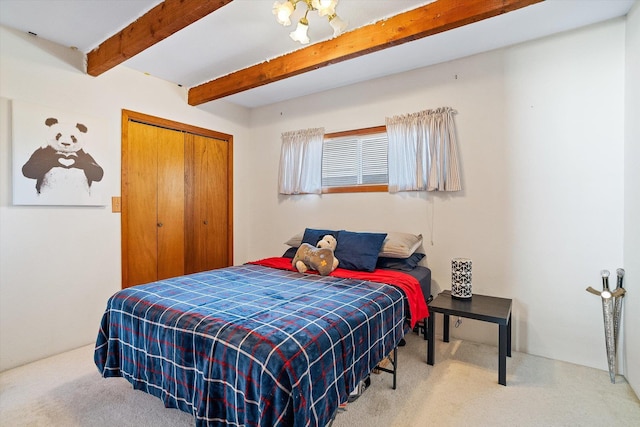 5003 N Normandie St, Spokane, WA 99205 - bedroom with carpet, beamed ceiling, and a closet