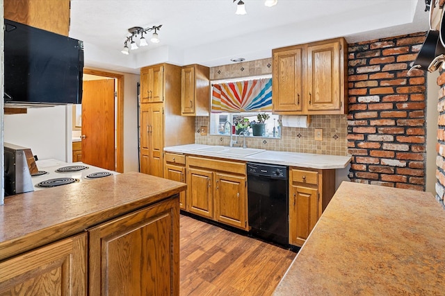 5003 N Normandie St, Spokane, WA 99205 - kitchen featuring black dishwasher, wood finished floors, light countertops, and backsplash