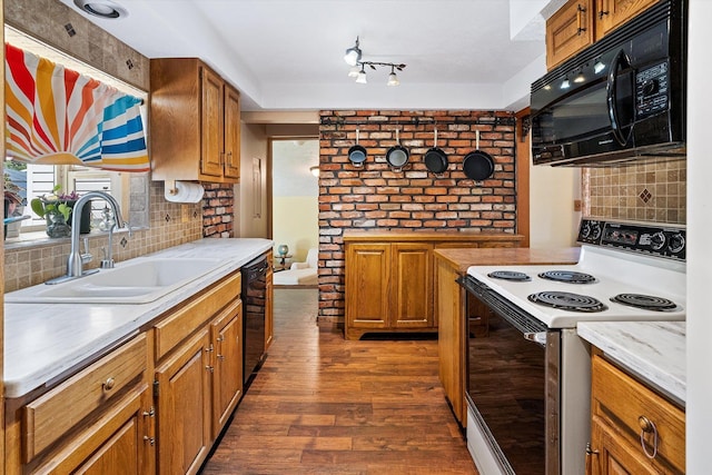 5003 N Normandie St, Spokane, WA 99205 - kitchen featuring black appliances, light countertops, and brown cabinets