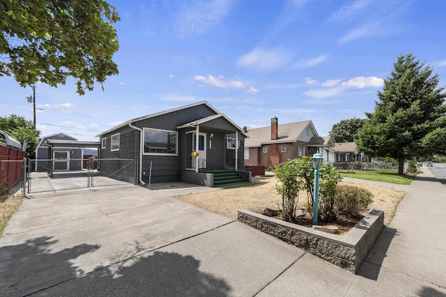 5218 E Commerce Ave, Spokane, WA 99212 - view of front facade with a gate and driveway