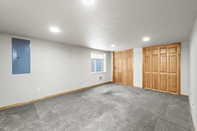 5218 E Commerce Ave, Spokane, WA 99212 - unfurnished bedroom with electric panel, two closets, recessed lighting, and carpet floors