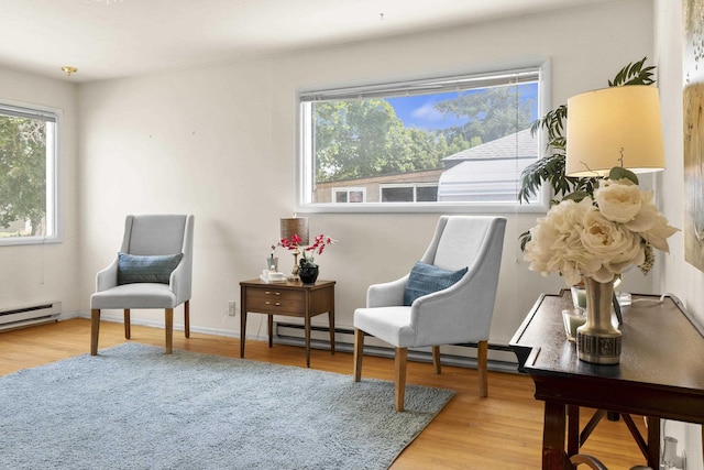 5218 E Commerce Ave, Spokane, WA 99212 - living area featuring wood finished floors and baseboard heating