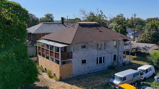 2917 E Broad Ave, Spokane, WA 99217 - back of property with a shingled roof and a balcony