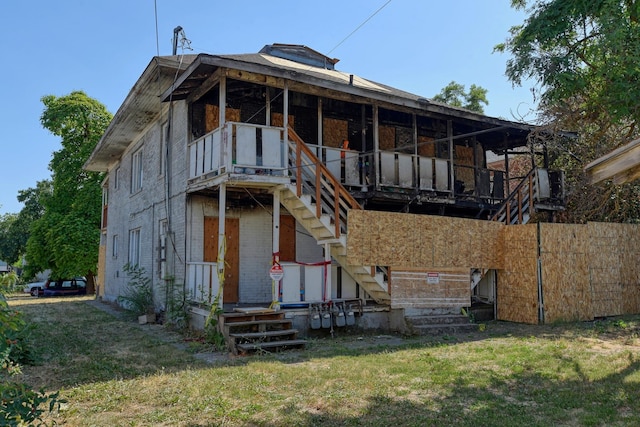 2917 E Broad Ave, Spokane, WA 99217 - rear view of property with stairs, a lawn, a deck, and brick siding