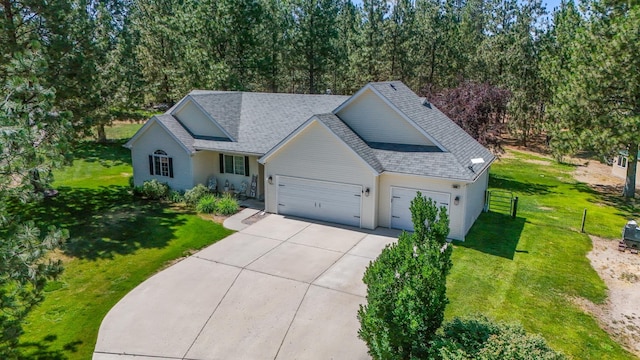 5885 Sandy Court Way, Nine Mile Falls, WA 99026 - traditional-style house with concrete driveway, a garage, and roof with shingles