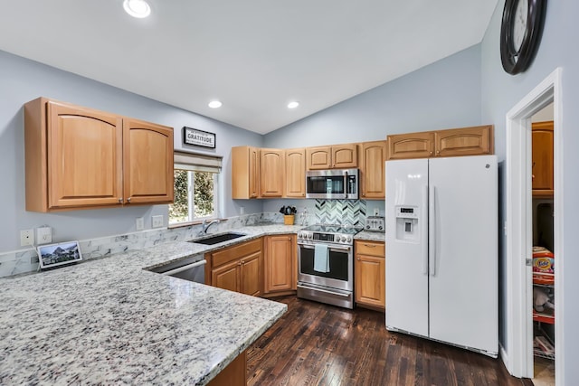 5885 Sandy Court Way, Nine Mile Falls, WA 99026 - kitchen with appliances with stainless steel finishes, lofted ceiling, light stone countertops, dark wood finished floors, and recessed lighting