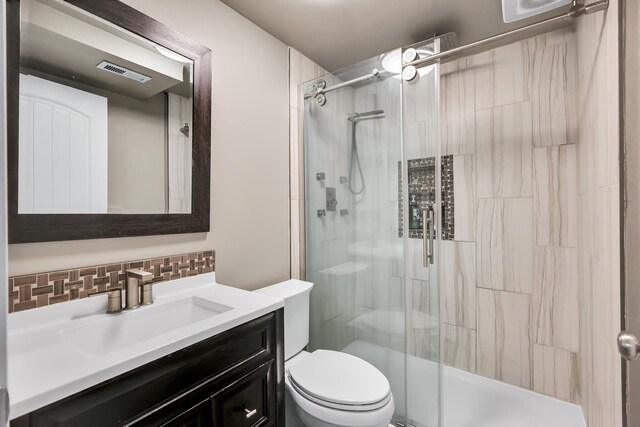 5885 Sandy Court Way, Nine Mile Falls, WA 99026 - full bathroom featuring decorative backsplash, vanity, and a shower stall