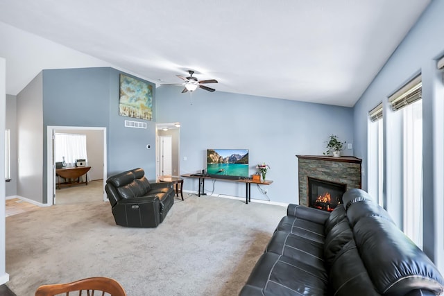 5885 Sandy Court Way, Nine Mile Falls, WA 99026 - living room with vaulted ceiling, carpet floors, ceiling fan, and a stone fireplace