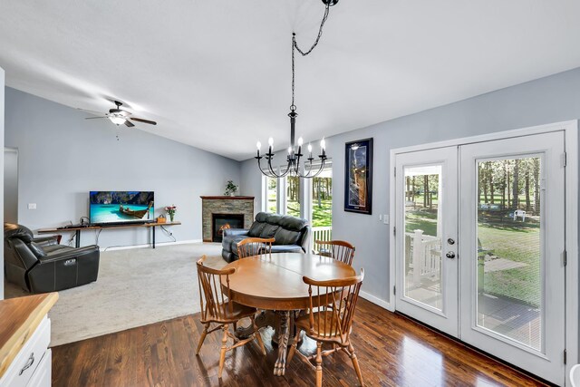 5885 Sandy Court Way, Nine Mile Falls, WA 99026 - dining space featuring lofted ceiling, healthy amount of natural light, a stone fireplace, and dark wood-style flooring