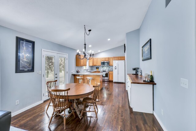 5885 Sandy Court Way, Nine Mile Falls, WA 99026 - dining area with a chandelier, lofted ceiling, dark wood-style flooring, and recessed lighting