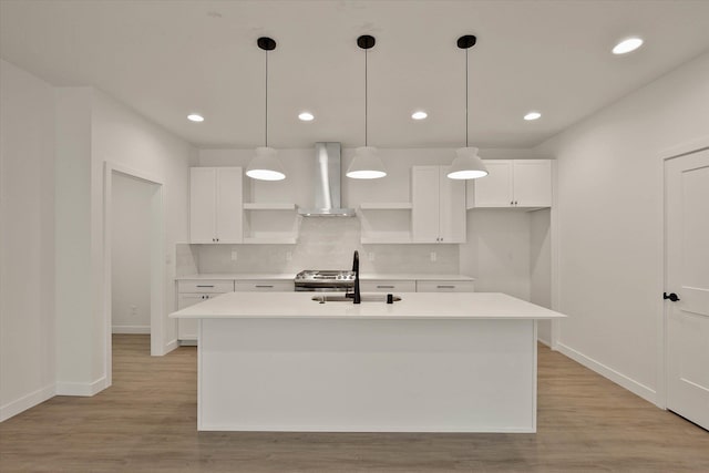 6203 E 13th Ln, Spokane Valley, WA 99212 - kitchen with wall chimney range hood, open shelves, light wood-style floors, white cabinetry, and recessed lighting