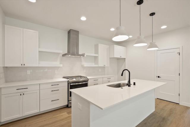 6203 E 13th Ln, Spokane Valley, WA 99212 - kitchen with open shelves, gas stove, wall chimney range hood, light wood-style flooring, and backsplash