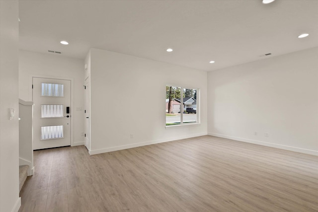 6203 E 13th Ln, Spokane Valley, WA 99212 - unfurnished living room with light wood-style flooring and recessed lighting