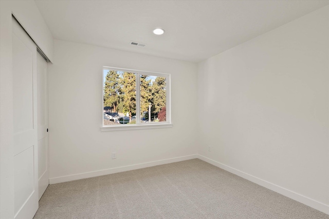 6203 E 13th Ln, Spokane Valley, WA 99212 - unfurnished bedroom with light carpet, a closet, and recessed lighting