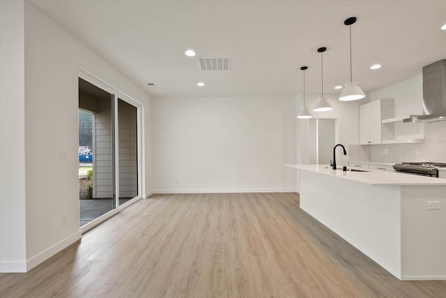 6203 E 13th Ln, Spokane Valley, WA 99212 - unfurnished living room featuring light wood-type flooring and recessed lighting