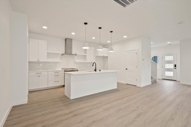 6203 E 13th Ln, Spokane Valley, WA 99212 - kitchen with open shelves, wall chimney exhaust hood, white cabinets, and recessed lighting