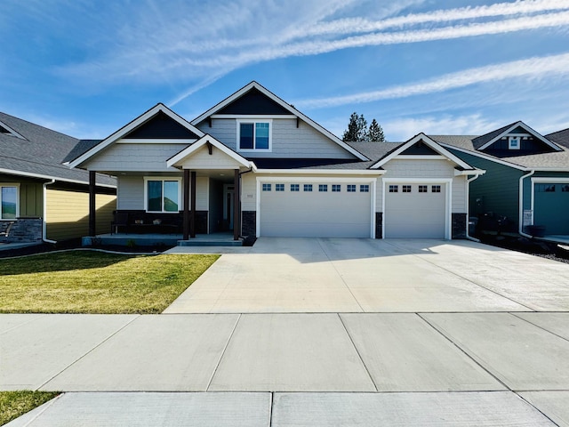 18096 N Morton Ct, Colbert, WA 99005 - craftsman inspired home featuring concrete driveway, a front lawn, a garage, and a porch