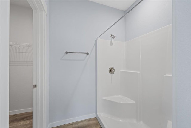 4919 E Grace Ave, Spokane, WA 99217 - full bath featuring a shower, wood finished floors, and a walk in closet