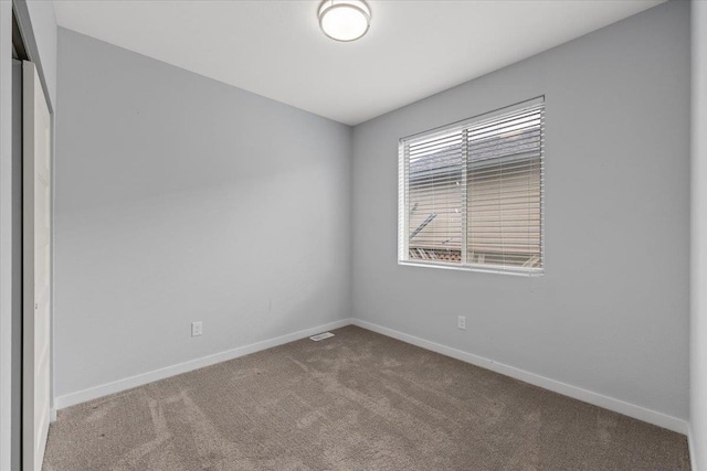 4919 E Grace Ave, Spokane, WA 99217 - empty room with carpet flooring and baseboards