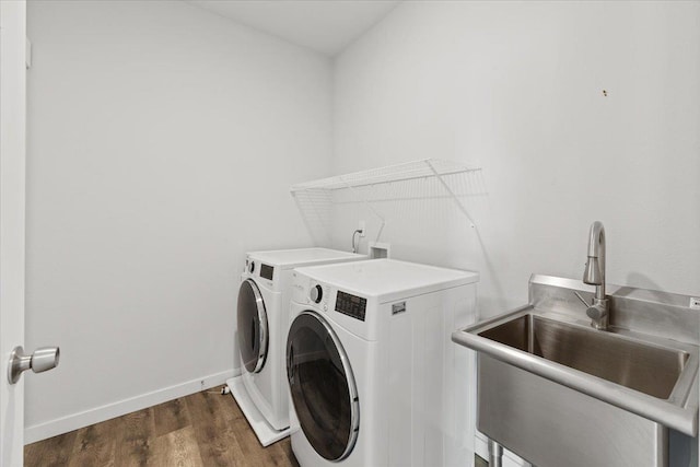 4919 E Grace Ave, Spokane, WA 99217 - laundry area featuring washing machine and clothes dryer and wood finished floors