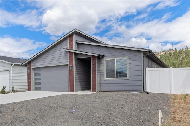 4919 E Grace Ave, Spokane, WA 99217 - view of front facade featuring a garage and driveway