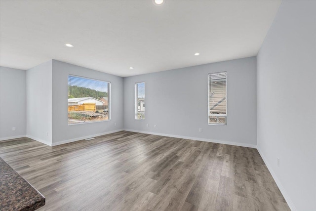 4919 E Grace Ave, Spokane, WA 99217 - unfurnished room with wood finished floors and recessed lighting