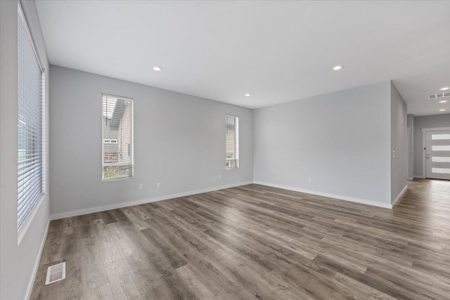 4919 E Grace Ave, Spokane, WA 99217 - spare room with wood finished floors and recessed lighting