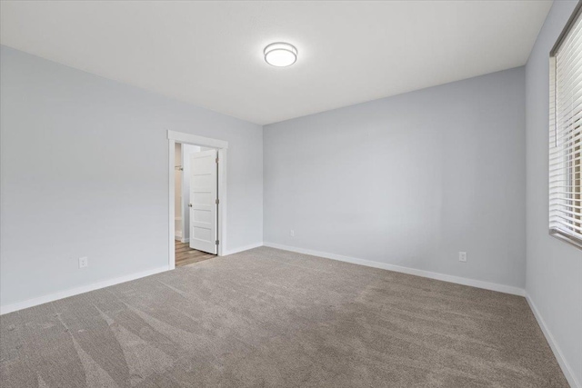 4919 E Grace Ave, Spokane, WA 99217 - carpeted empty room featuring baseboards