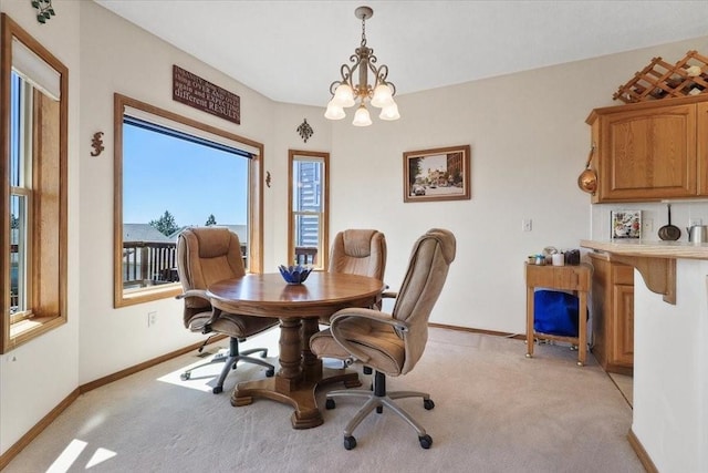 8710 E Sugar Pine Ln, Spokane, WA 99217 - dining area featuring light colored carpet, a chandelier, and an office area