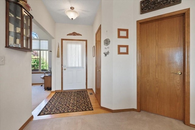 8710 E Sugar Pine Ln, Spokane, WA 99217 - entryway featuring light carpet and baseboards