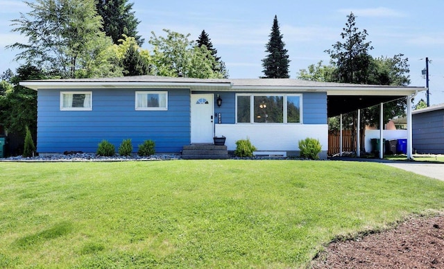 6914 N Jefferson St, Spokane, WA 99208 - ranch-style home featuring a carport, entry steps, a front lawn, and driveway