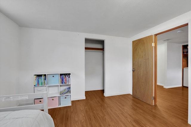 6914 N Jefferson St, Spokane, WA 99208 - bedroom featuring wood finished floors and a closet