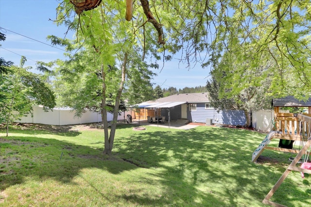 6914 N Jefferson St, Spokane, WA 99208 - fenced backyard featuring a playground and a patio