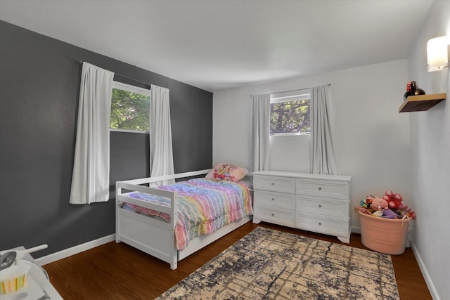 6914 N Jefferson St, Spokane, WA 99208 - bedroom with multiple windows and dark wood-style flooring