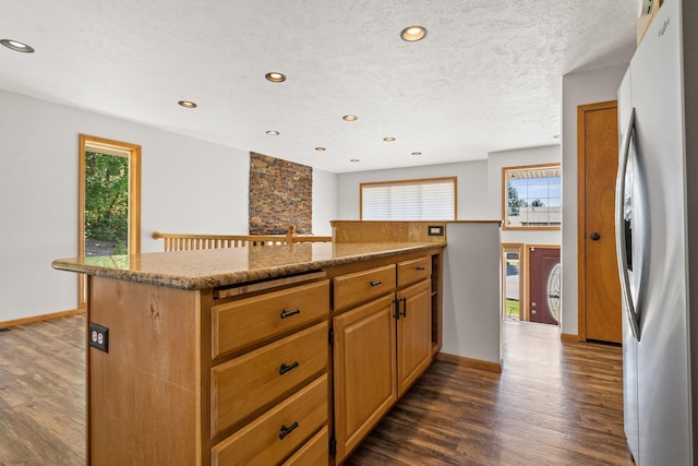 8603 E Columbia Park Dr, Spokane Valley, WA 99212 - kitchen featuring freestanding refrigerator, dark wood-style flooring, plenty of natural light, and recessed lighting