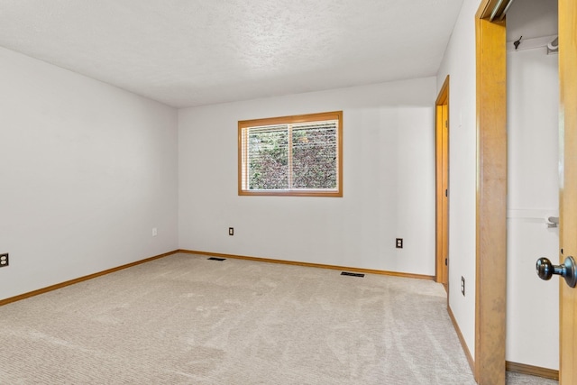 8603 E Columbia Park Dr, Spokane Valley, WA 99212 - unfurnished bedroom with carpet floors and a textured ceiling