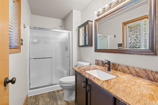 8603 E Columbia Park Dr, Spokane Valley, WA 99212 - full bathroom with vanity, a stall shower, and wood finished floors