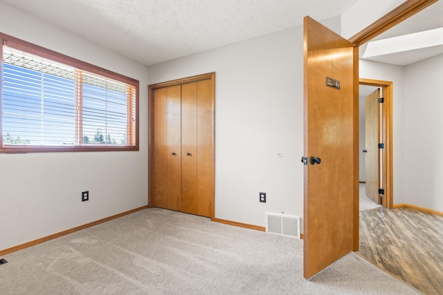 8603 E Columbia Park Dr, Spokane Valley, WA 99212 - unfurnished bedroom featuring a closet and carpet floors
