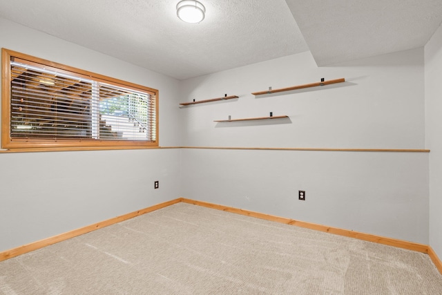 8603 E Columbia Park Dr, Spokane Valley, WA 99212 - carpeted empty room featuring baseboards and a textured ceiling
