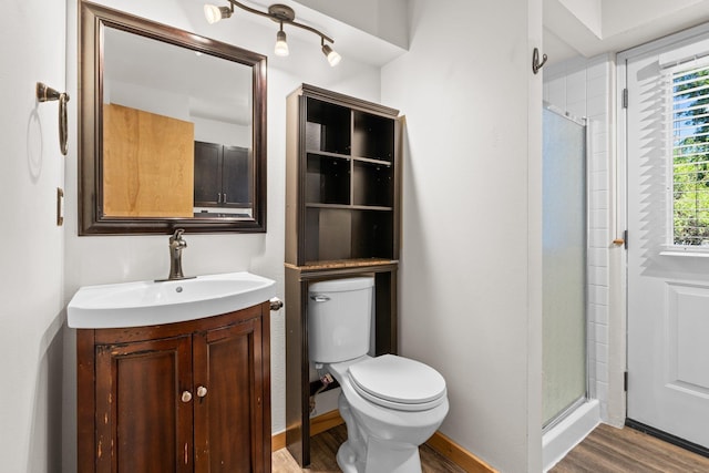8603 E Columbia Park Dr, Spokane Valley, WA 99212 - bathroom with wood finished floors, vanity, and a stall shower