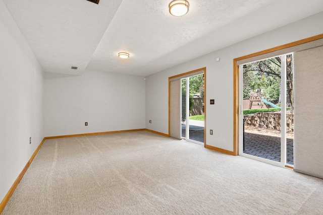 8603 E Columbia Park Dr, Spokane Valley, WA 99212 - unfurnished room featuring light colored carpet and a textured ceiling