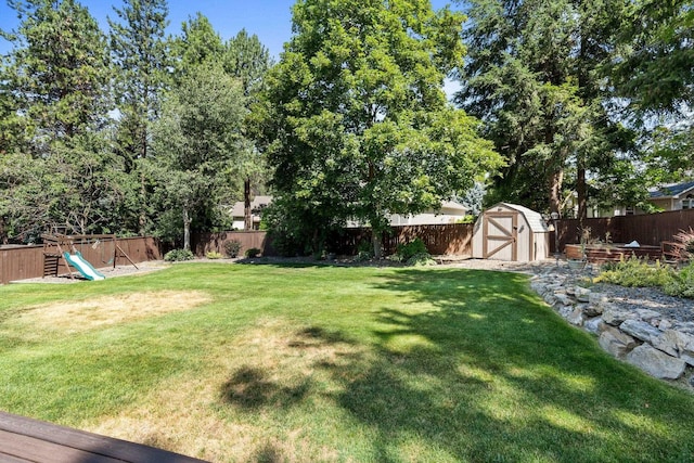 8603 E Columbia Park Dr, Spokane Valley, WA 99212 - fenced backyard featuring a shed and a playground