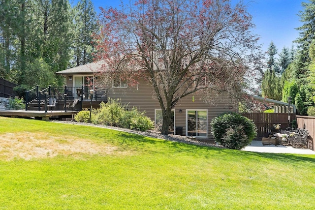 8603 E Columbia Park Dr, Spokane Valley, WA 99212 - rear view of house featuring a wooden deck and a patio area
