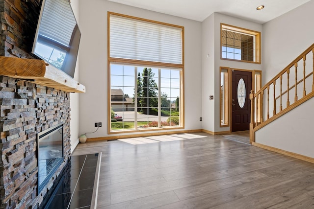 8603 E Columbia Park Dr, Spokane Valley, WA 99212 - foyer with wood finished floors, stairs, a high ceiling, a fireplace, and recessed lighting