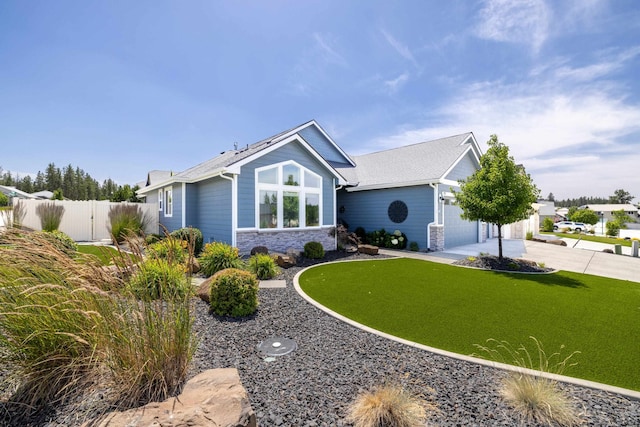 705 W Basalt Ridge Dr, Spokane, WA 99224 - view of front facade featuring a garage, concrete driveway, and stone siding