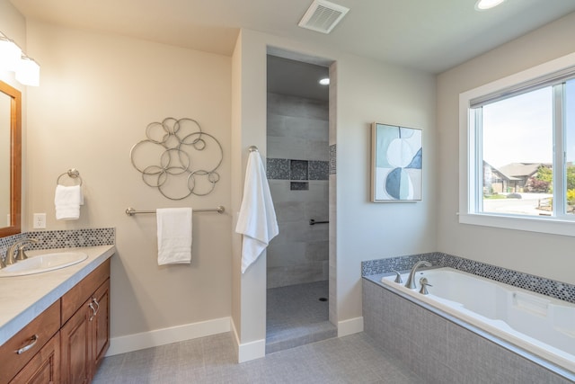 705 W Basalt Ridge Dr, Spokane, WA 99224 - full bathroom featuring vanity, a garden tub, healthy amount of natural light, and walk in shower