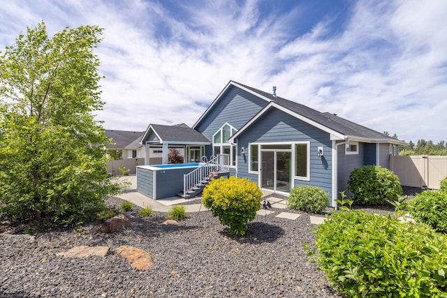 705 W Basalt Ridge Dr, Spokane, WA 99224 - back of property featuring a patio area and a fenced backyard