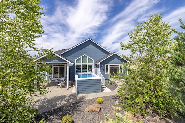 705 W Basalt Ridge Dr, Spokane, WA 99224 - back of property with a patio and a sunroom