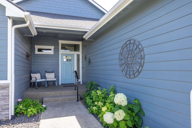 705 W Basalt Ridge Dr, Spokane, WA 99224 - doorway to property featuring covered porch and a shingled roof